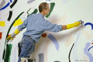 Roy Lichtenstein laying in color on 10 x 15-foot painting Forest Scene with Temple (1986). © Bob Adelman