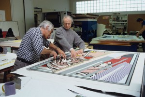 Kenneth Tyler and Roy Lichtenstein cutting silver metalised PVC plastic film for Reflections on conversation from the Reflections series, Tyler Graphics Ltd., Mount Kisco, New York, 1990. National Gallery of Australia, Canberra Gift of Kenneth Tyler, 2002 Photograph by Marabeth Cohen-Tyler