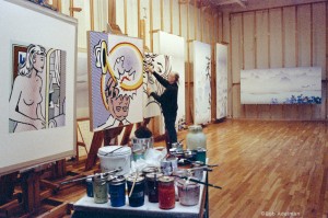 Roy Lichtenstein working on Seductive Girl (1996) in his Washington Street studio, ca. 1996. Also pictured: Coup de chapeau, Landscape with Bridge and Landscape with Philosopher (all 1996). © Bob Adelman