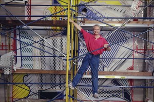 Roy Lichtenstein on scaffold at the CAA building in Beverly Hills, CA, painting Bauhaus Stairway Mural, 1989. © Alan Levenson