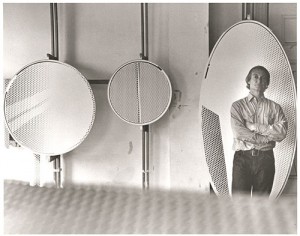 Roy Lichtenstein standing in front of Mirror #1 (6’ x 3’) (1971) in his Southampton studio; also pictured: Mirror #8 (36” diameter) (1971) and Mirror #12 (24” diameter) (1970). © Renate Ponsold